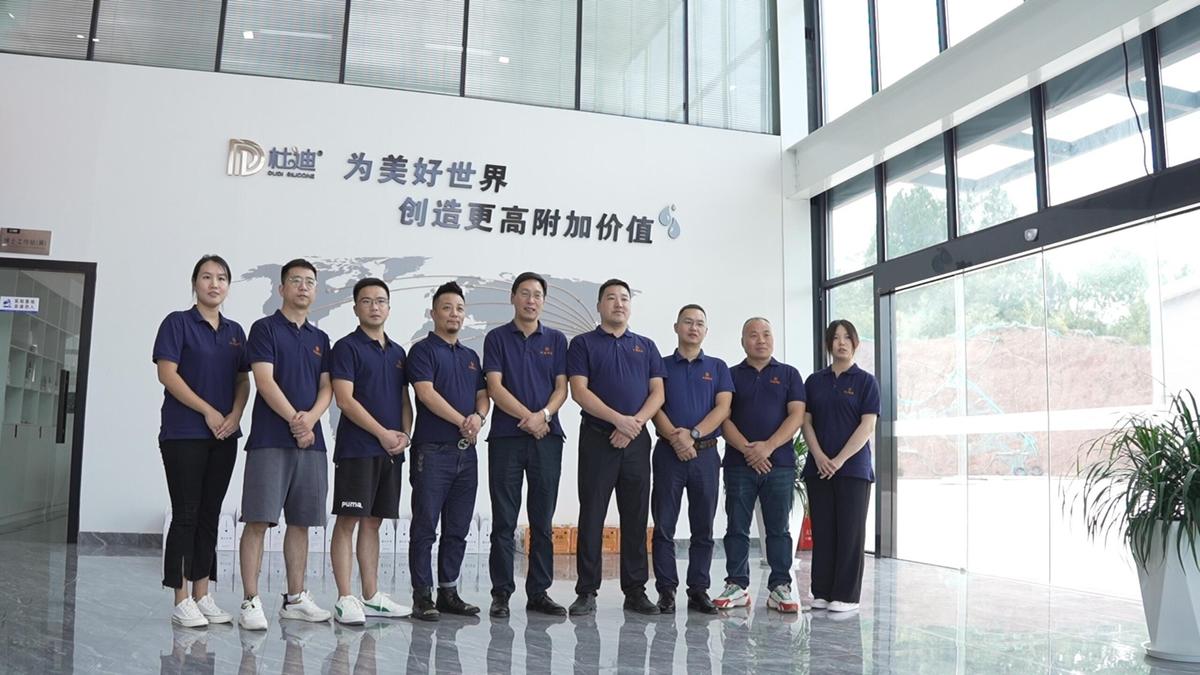 DUDI team standing in the company reception area